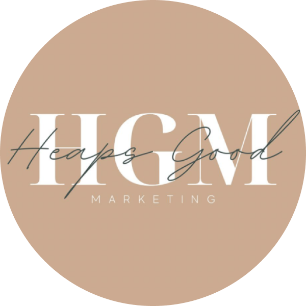 Logo of Heaps Good Marketing (HGM) with white text on a beige circular background. "Heaps Good" is cursive, overlaying "HGM" in capital letters, with "MARKETING" in smaller letters below, representing a social media scheduler | plannthat.com